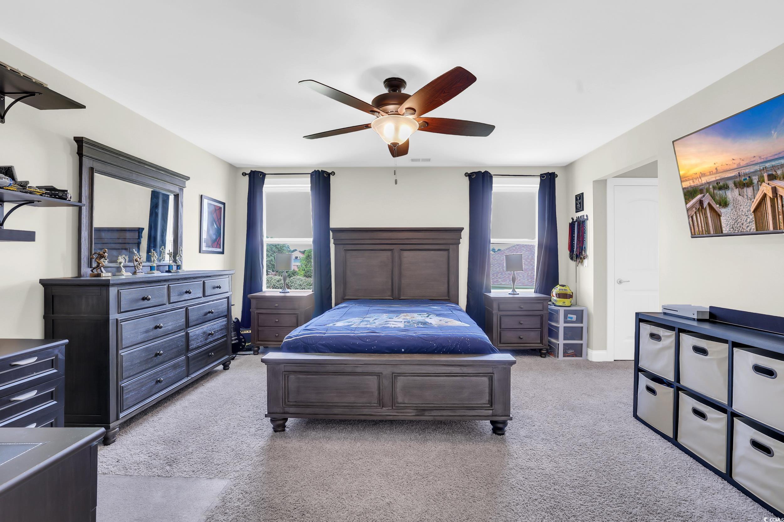 259 Hull Street Surfside Beach, SC 29575 - Photo 31 of 40 Carpeted bedroom with ceiling fan