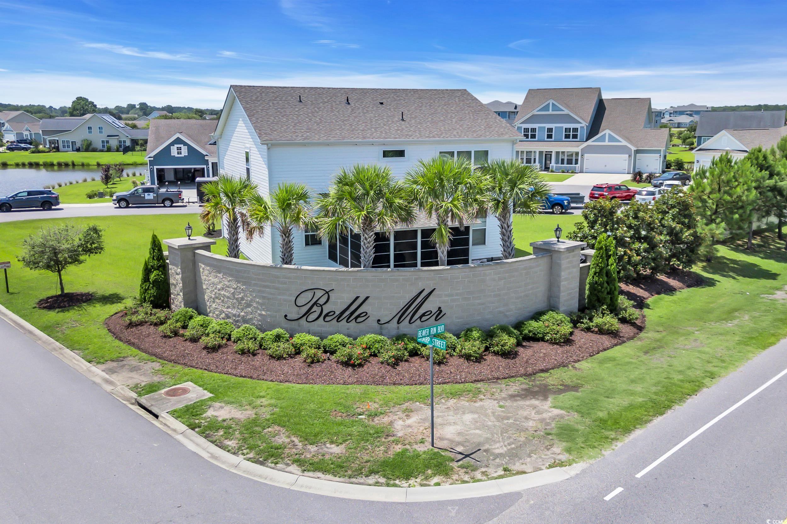 259 Hull Street Surfside Beach, SC 29575 - Photo 39 of 40 Community sign featuring a residential view, a water view, and a lawn