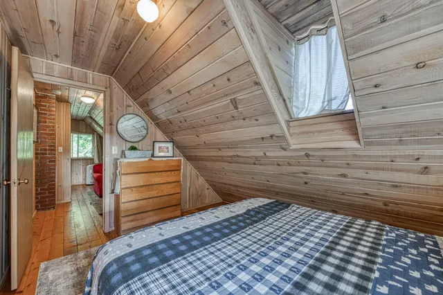 a bedroom with a bed and a cabinets