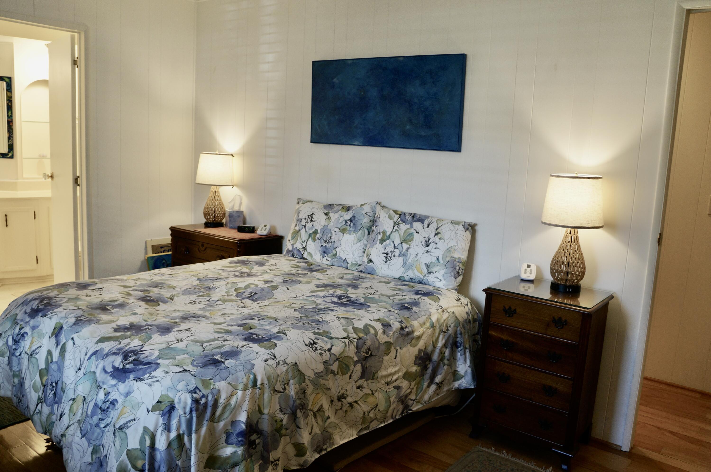 340 Old Mill Road, Unit 20 Santa Barbara, CA 93110 - Photo 6 of 15 a bedroom with a bed and a lamp