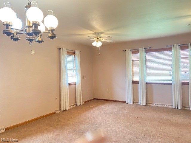 1772 Bantam Ridge Road Steubenville, OH 43953 - Photo 6 of 43 Unfurnished room with light colored carpet and ceiling fan with notable chandelier