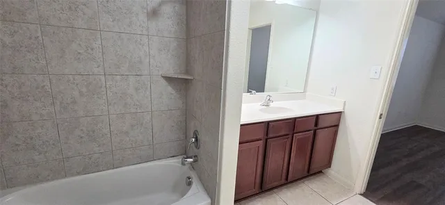 a bathroom with a sink and a bathtub