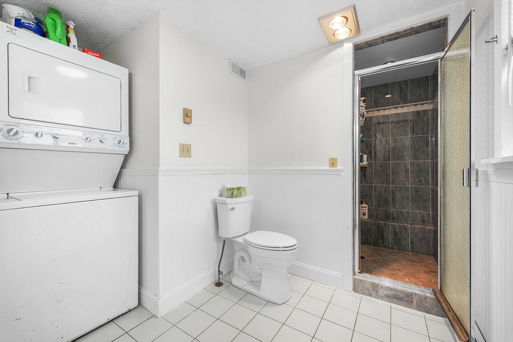 8 Barnes Street Wareham, MA 02571 - Photo 12 of 37 a bathroom with a toilet and a shower