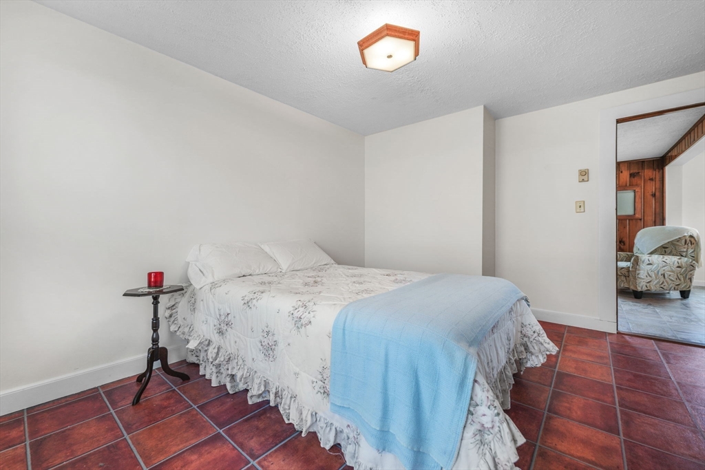 8 Barnes Street Wareham, MA 02571 - Photo 19 of 37 a bedroom with a bed and a window