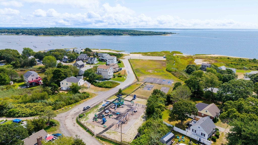 8 Barnes Street Wareham, MA 02571 - Photo 35 of 37 a view of a lake with a building in the background
