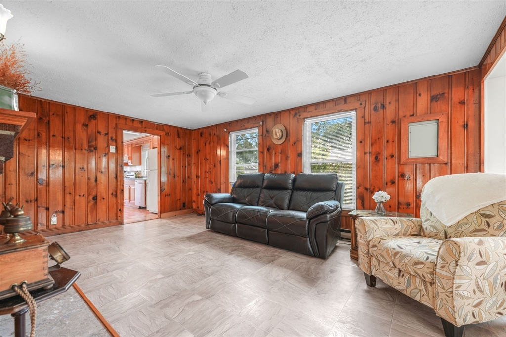 8 Barnes Street Wareham, MA 02571 - Photo 8 of 37 a living room with furniture and large windows