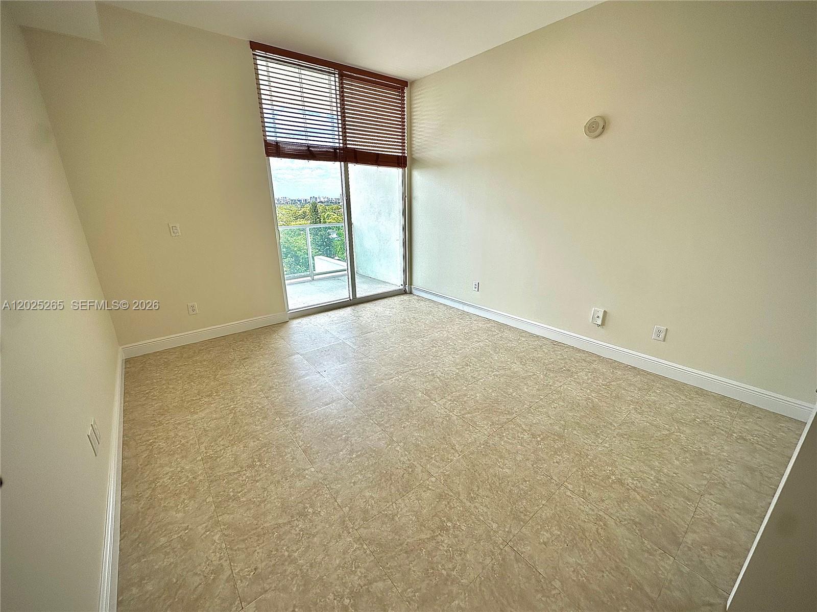 2525 Southwest 3rd Avenue, Unit 705 Miami, FL 33129 - Photo 13 of 26 a view of an empty room with a window