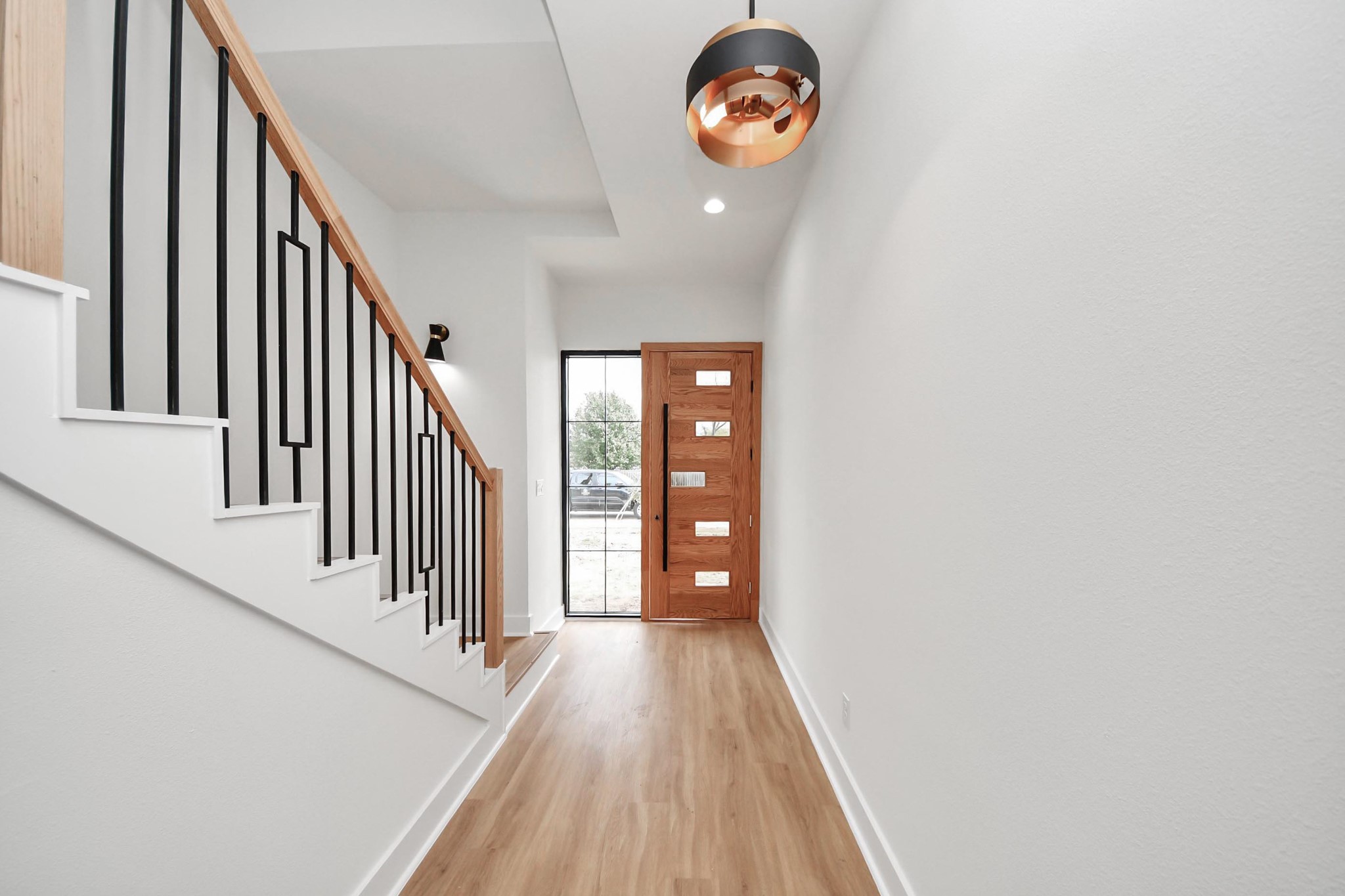 9014 Ferdinand Street Houston, TX 77051 - Photo 13 of 40 a view of a hallway with wooden floor