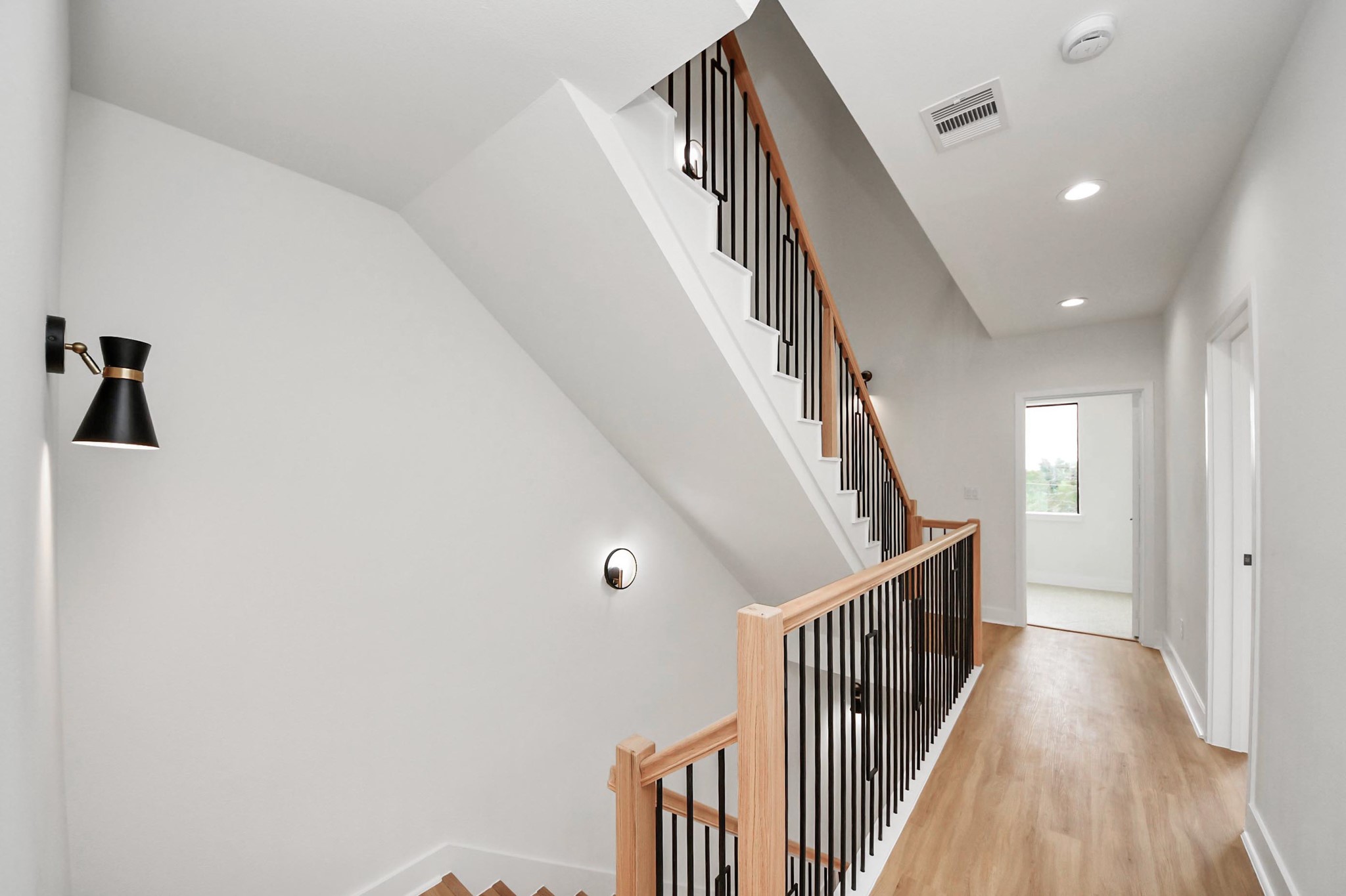 9014 Ferdinand Street Houston, TX 77051 - Photo 15 of 40 a view of a hallway with wooden floor and entryway