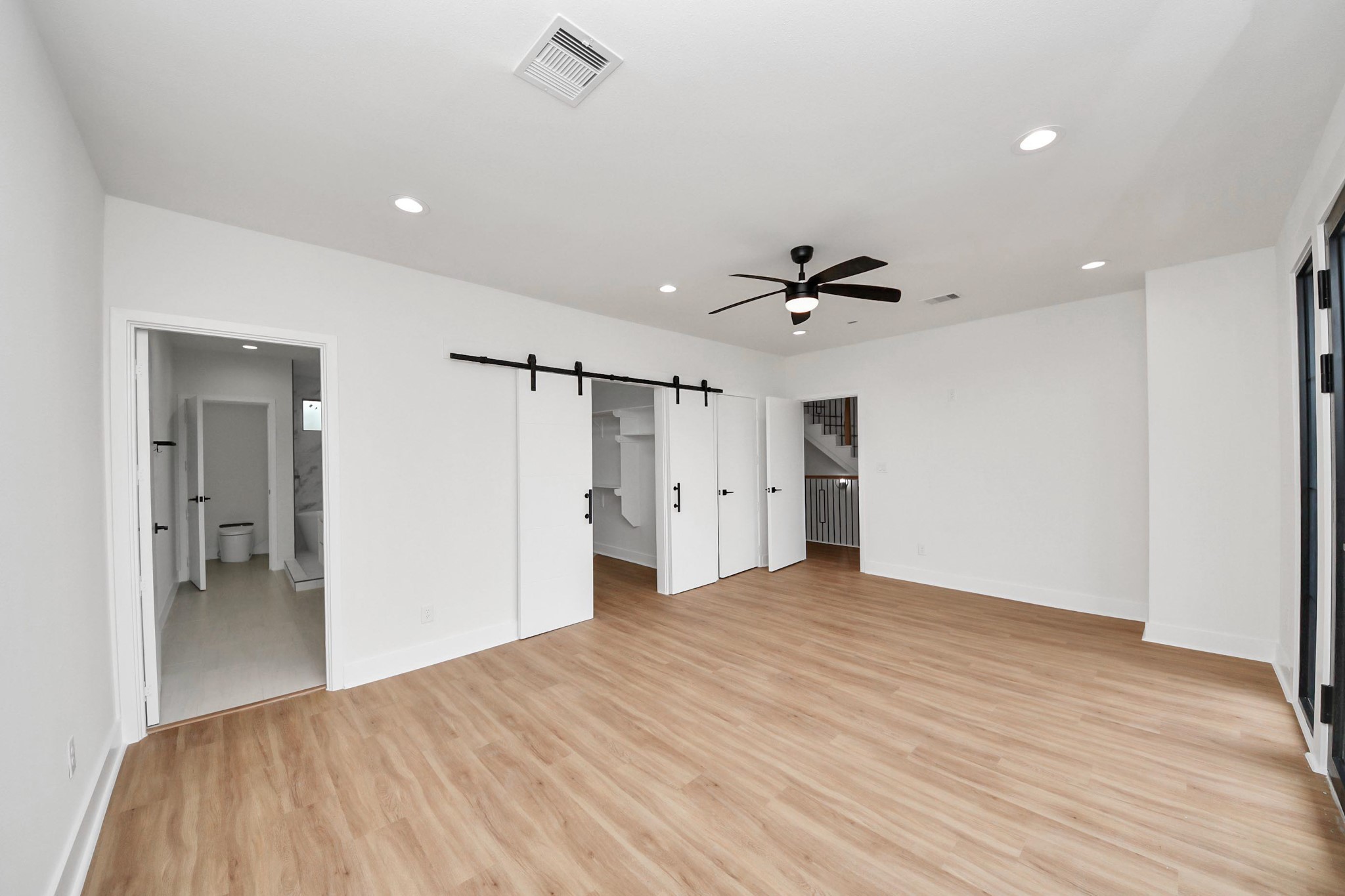 9014 Ferdinand Street Houston, TX 77051 - Photo 16 of 40 a view of a livingroom with a ceiling fan & entryway