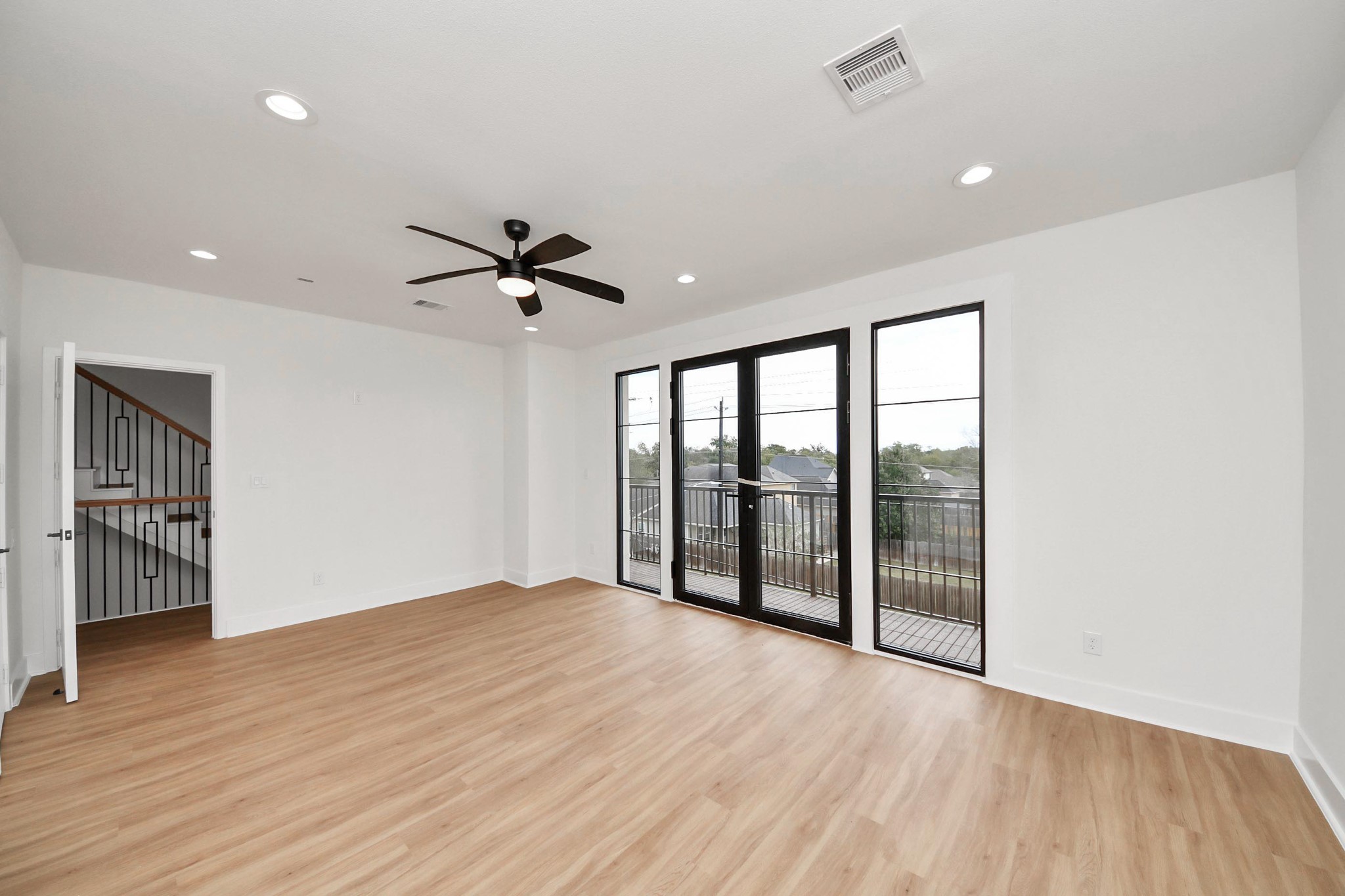9014 Ferdinand Street Houston, TX 77051 - Photo 17 of 40 wooden floor in an empty room with a window