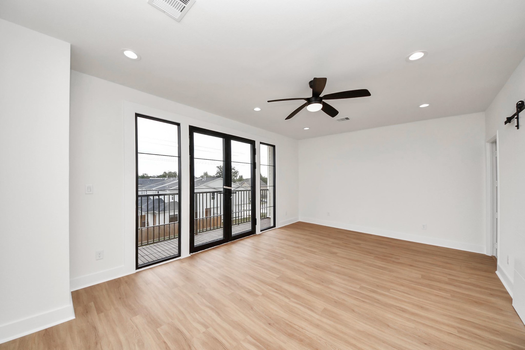 9014 Ferdinand Street Houston, TX 77051 - Photo 18 of 40 wooden floor in an empty room with a window