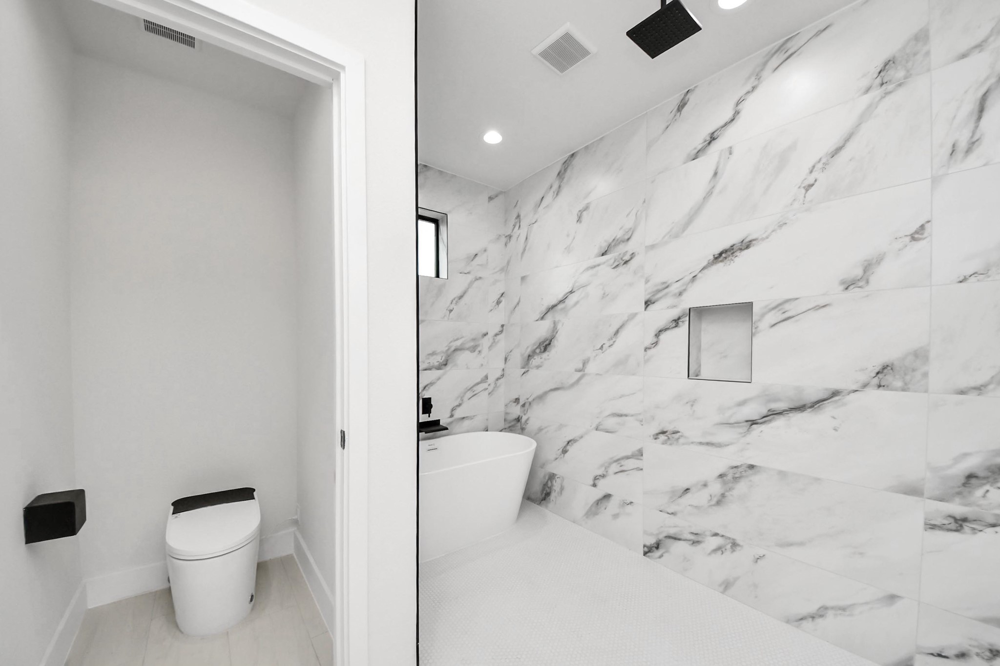9014 Ferdinand Street Houston, TX 77051 - Photo 21 of 40 a bathroom with a toilet sink and shower