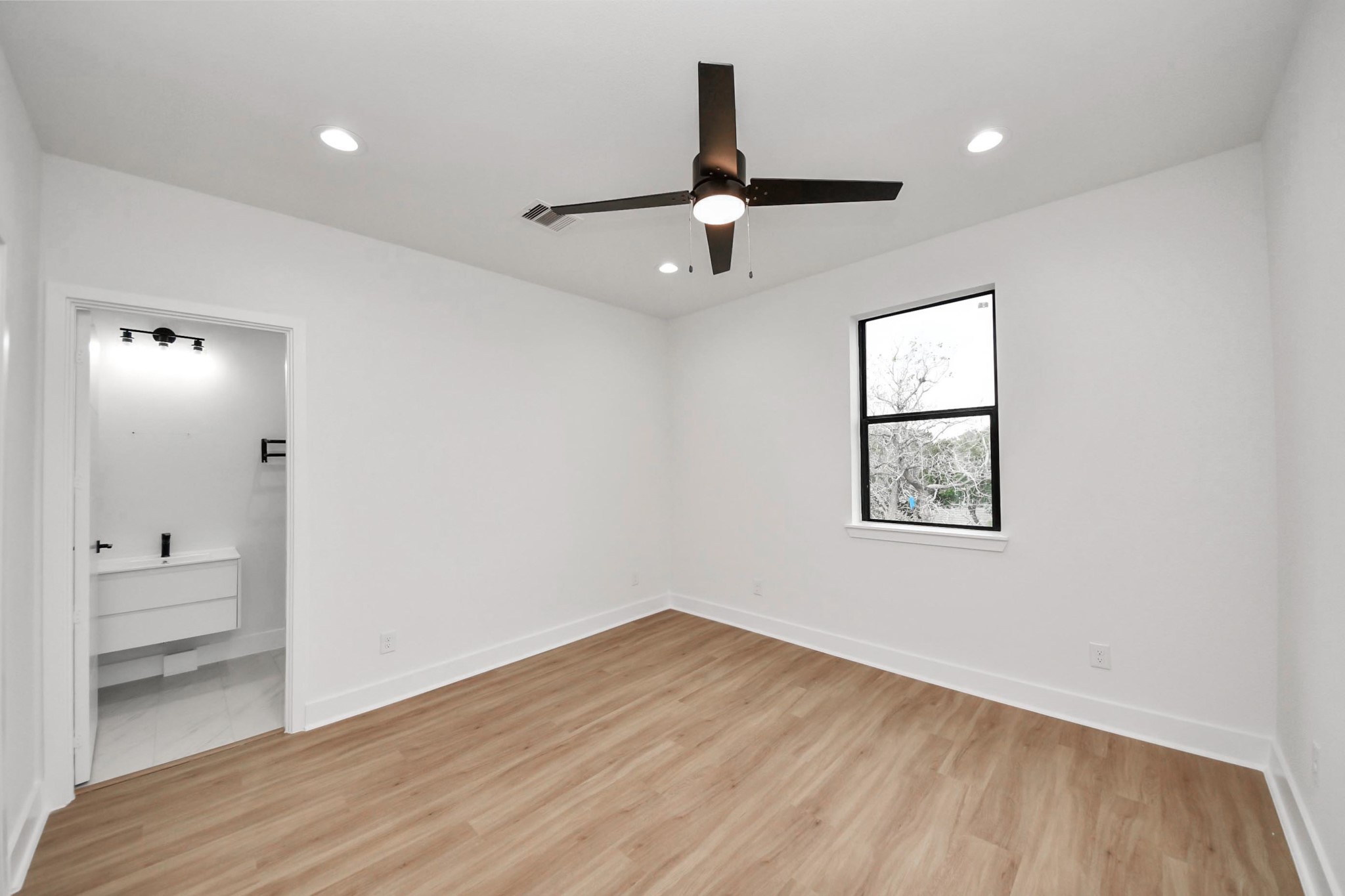 9014 Ferdinand Street Houston, TX 77051 - Photo 24 of 40 wooden floor in an empty room with a window