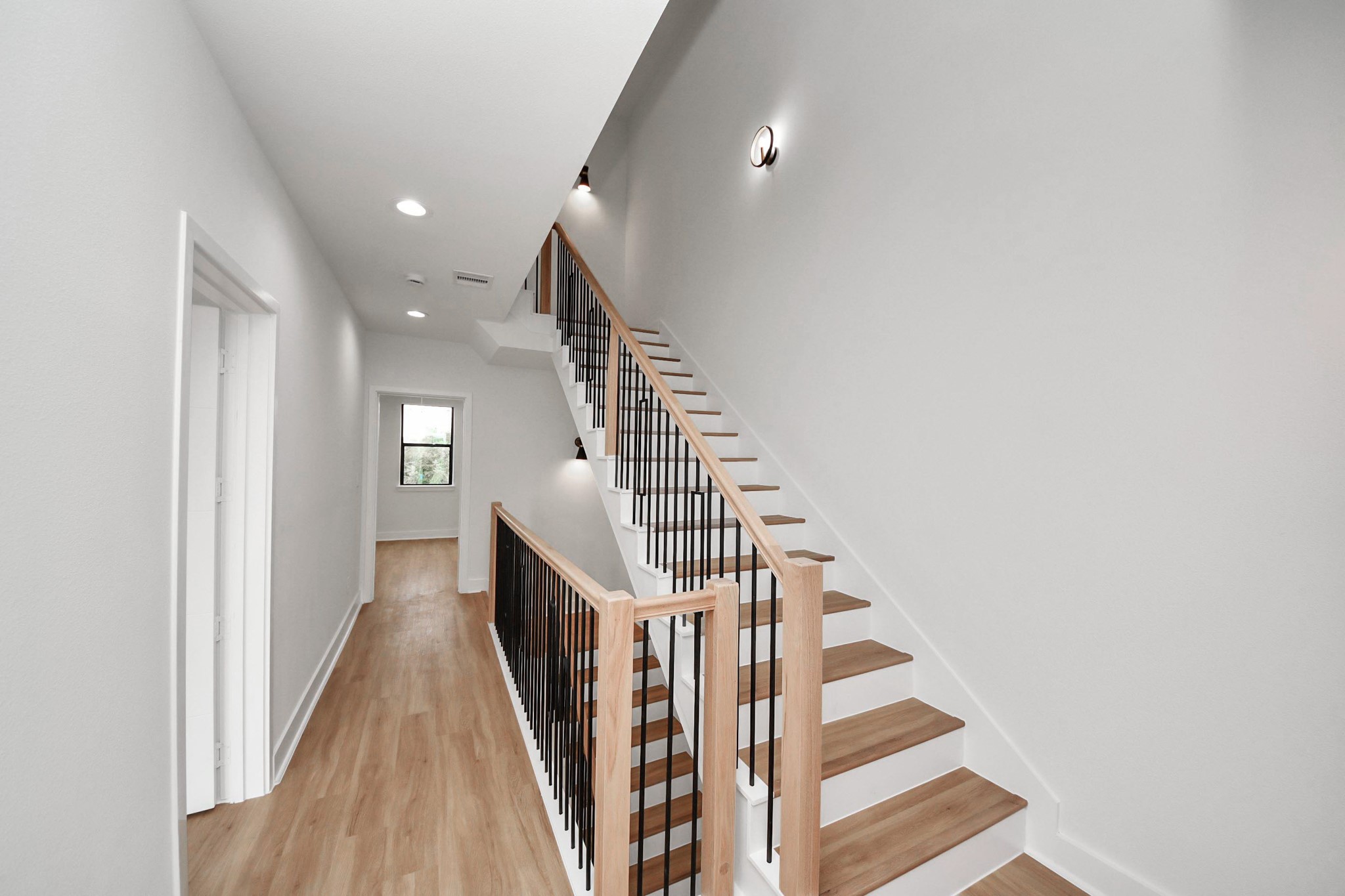 9014 Ferdinand Street Houston, TX 77051 - Photo 28 of 40 a view of entryway and hall with wooden floor