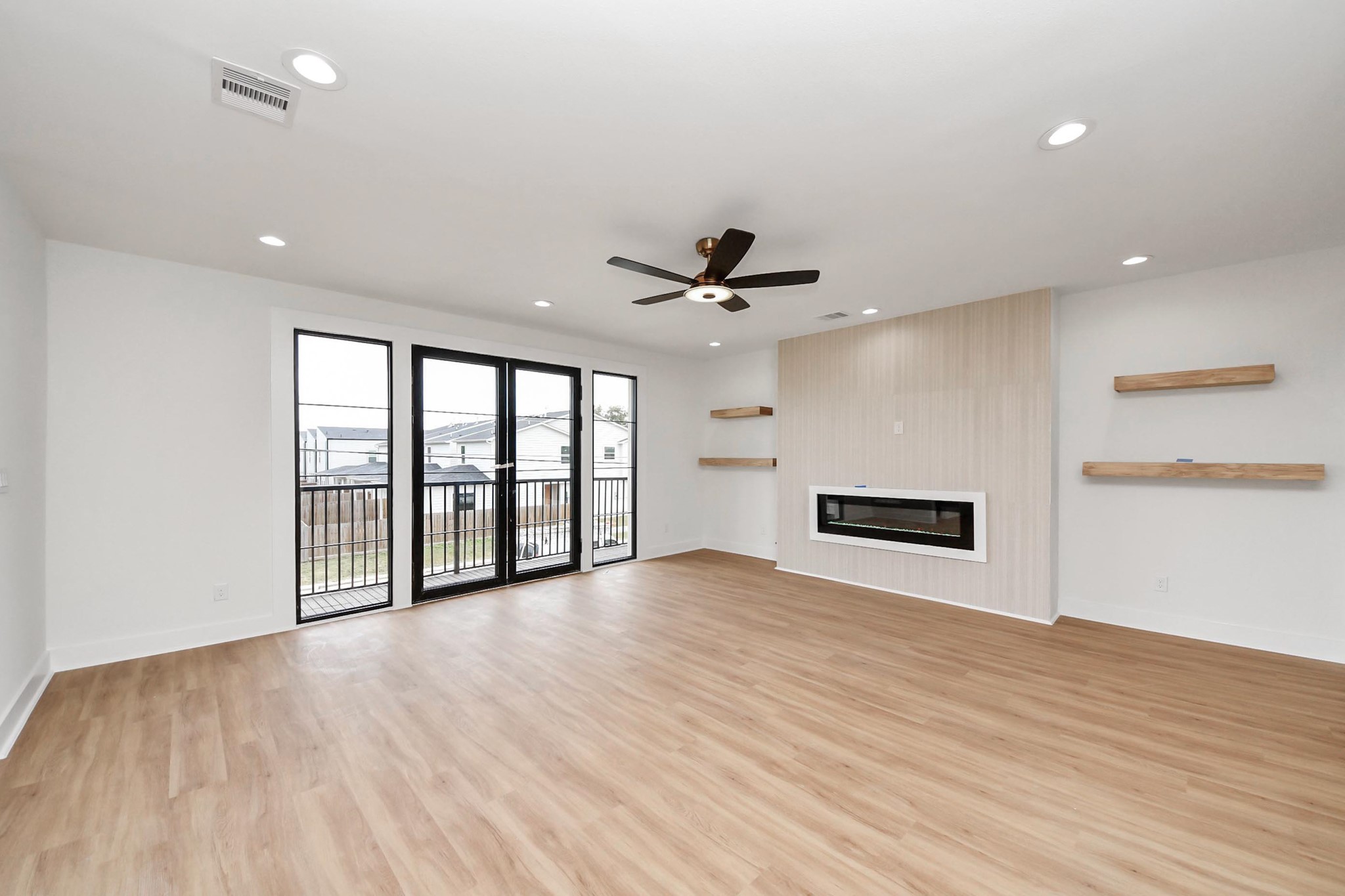 9014 Ferdinand Street Houston, TX 77051 - Photo 9 of 40 a view of an empty room with a window and wooden floor