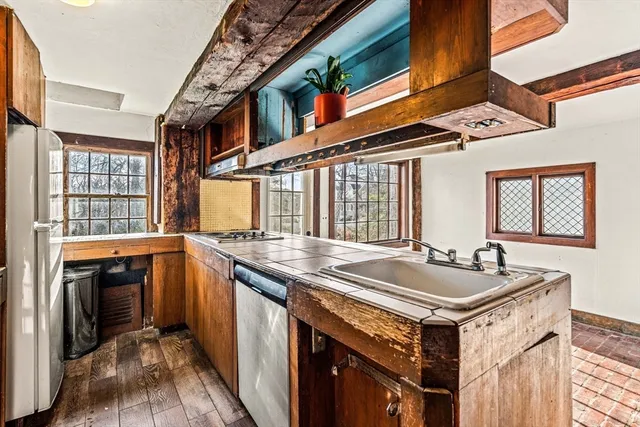 a kitchen with a stove and a sink