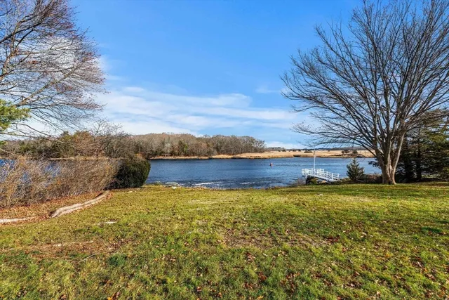 a view of a lake with a big yard