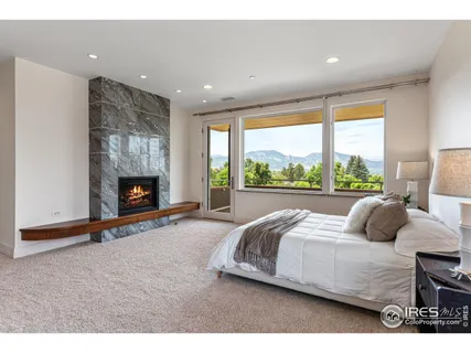 a bedroom with bed and a fireplace