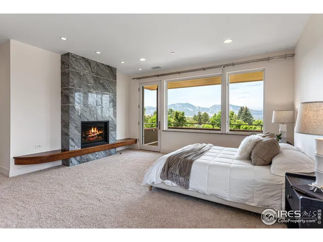 a bedroom with bed and a fireplace