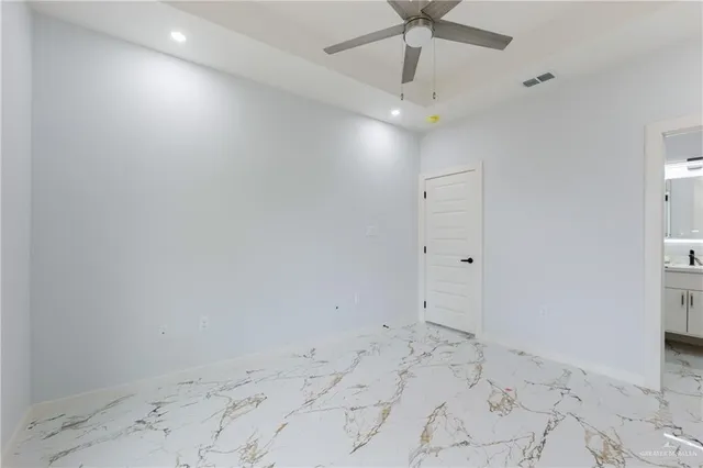 a view of an empty room and window