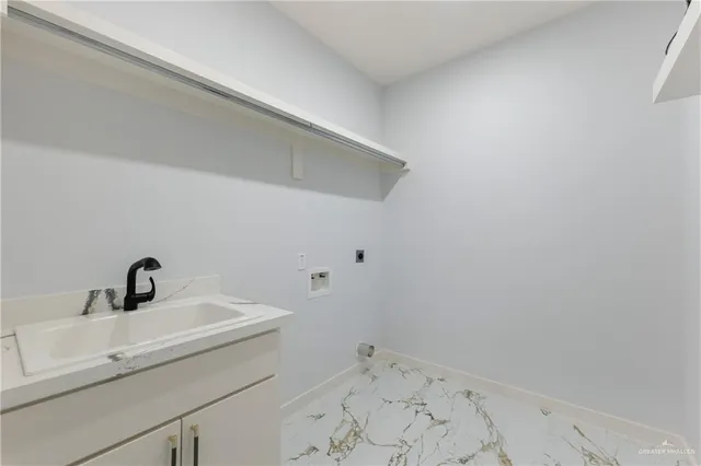 a bathroom with a sink double vanity granite tub shower and a mirror