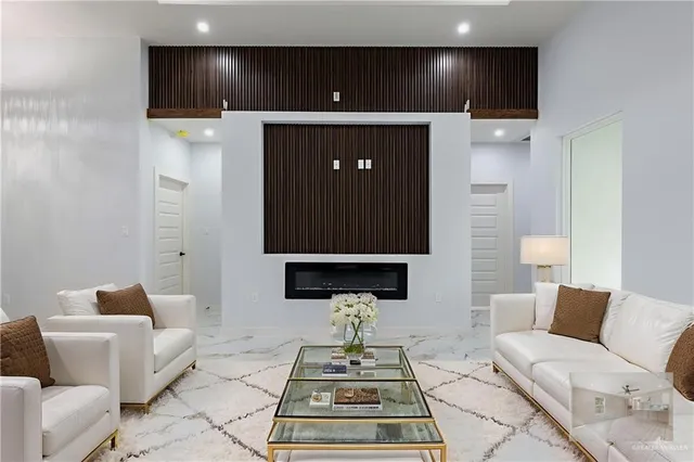 a bedroom with a bed a couch and dresser