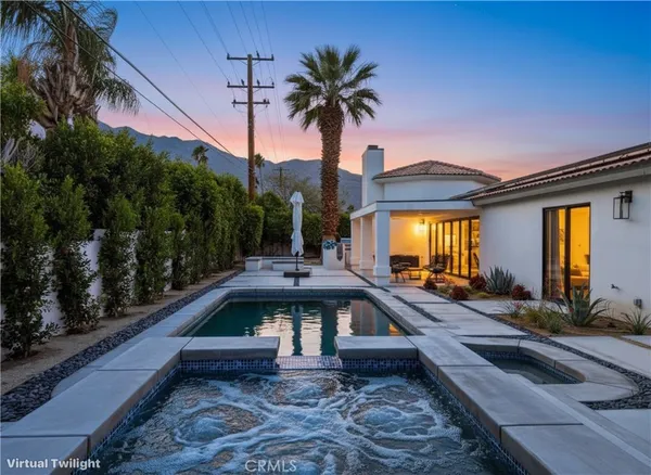 a view of a patio with swimming pool table and chairs
