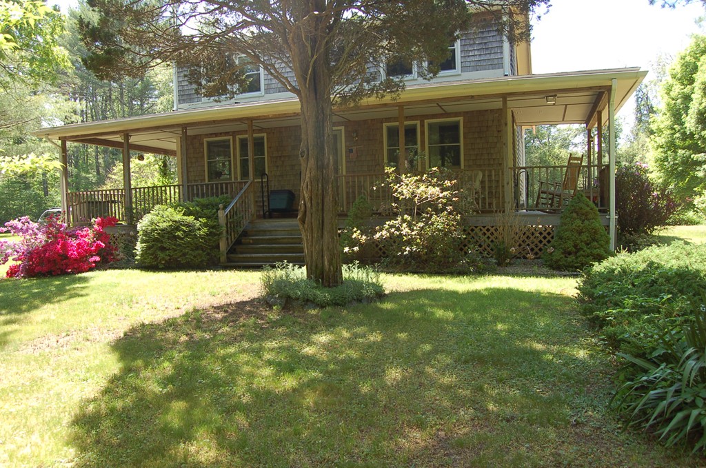 519 County Road Rochester, MA 02576 - Photo 3 of 22 a front view of a house with garden