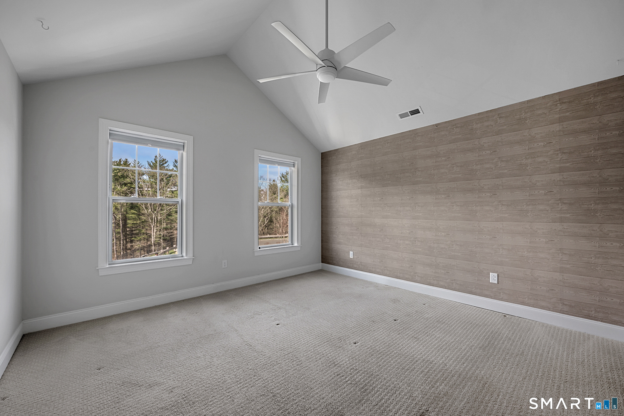 193 Ridgewood Drive, Unit 193 Middlebury, CT 06762 - Photo 18 of 40 an empty room with a window and a fan