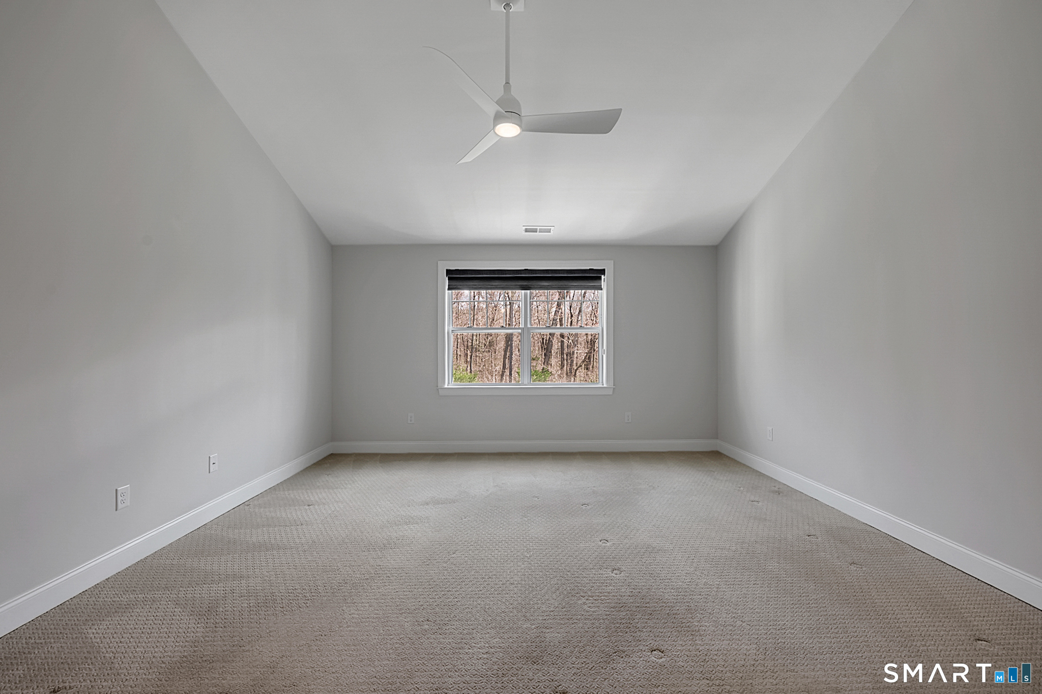 193 Ridgewood Drive, Unit 193 Middlebury, CT 06762 - Photo 24 of 40 an empty room with a window