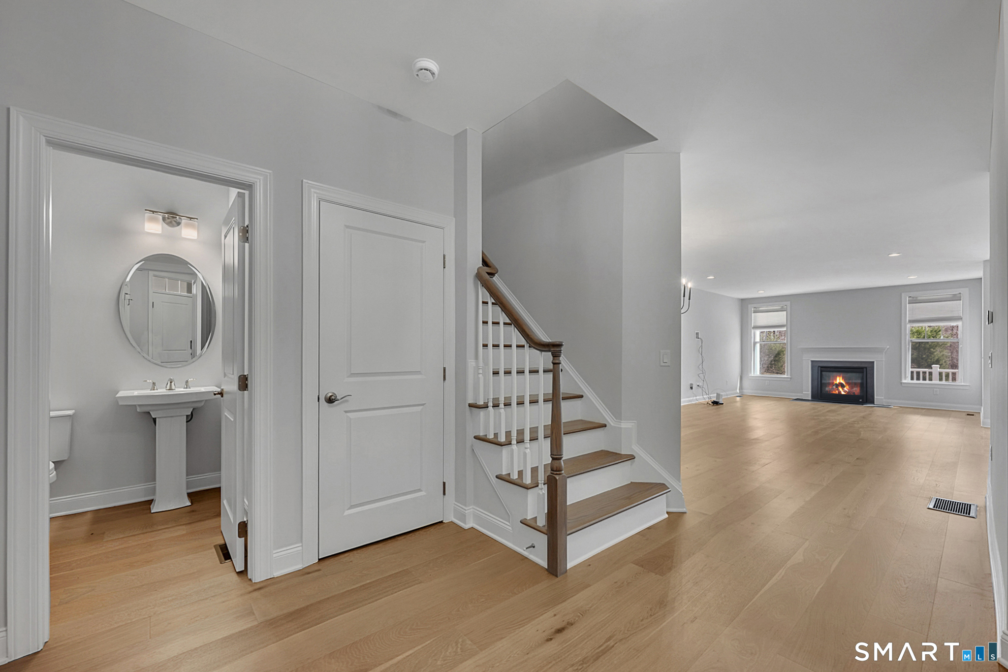 193 Ridgewood Drive, Unit 193 Middlebury, CT 06762 - Photo 6 of 40 a view of an entryway with wooden floor and a livingroom view