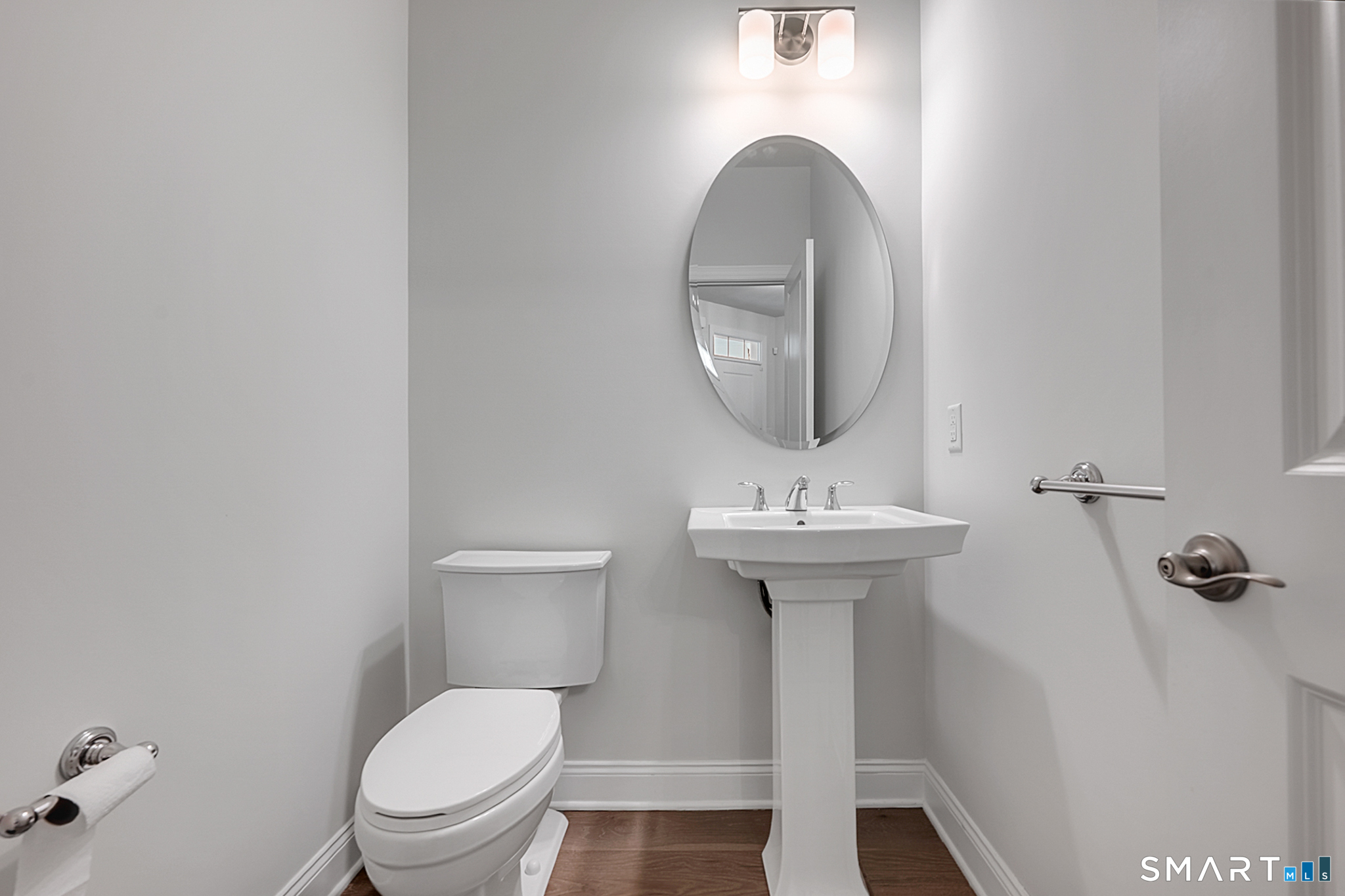 193 Ridgewood Drive, Unit 193 Middlebury, CT 06762 - Photo 7 of 40 a bathroom with a toilet a sink and mirror
