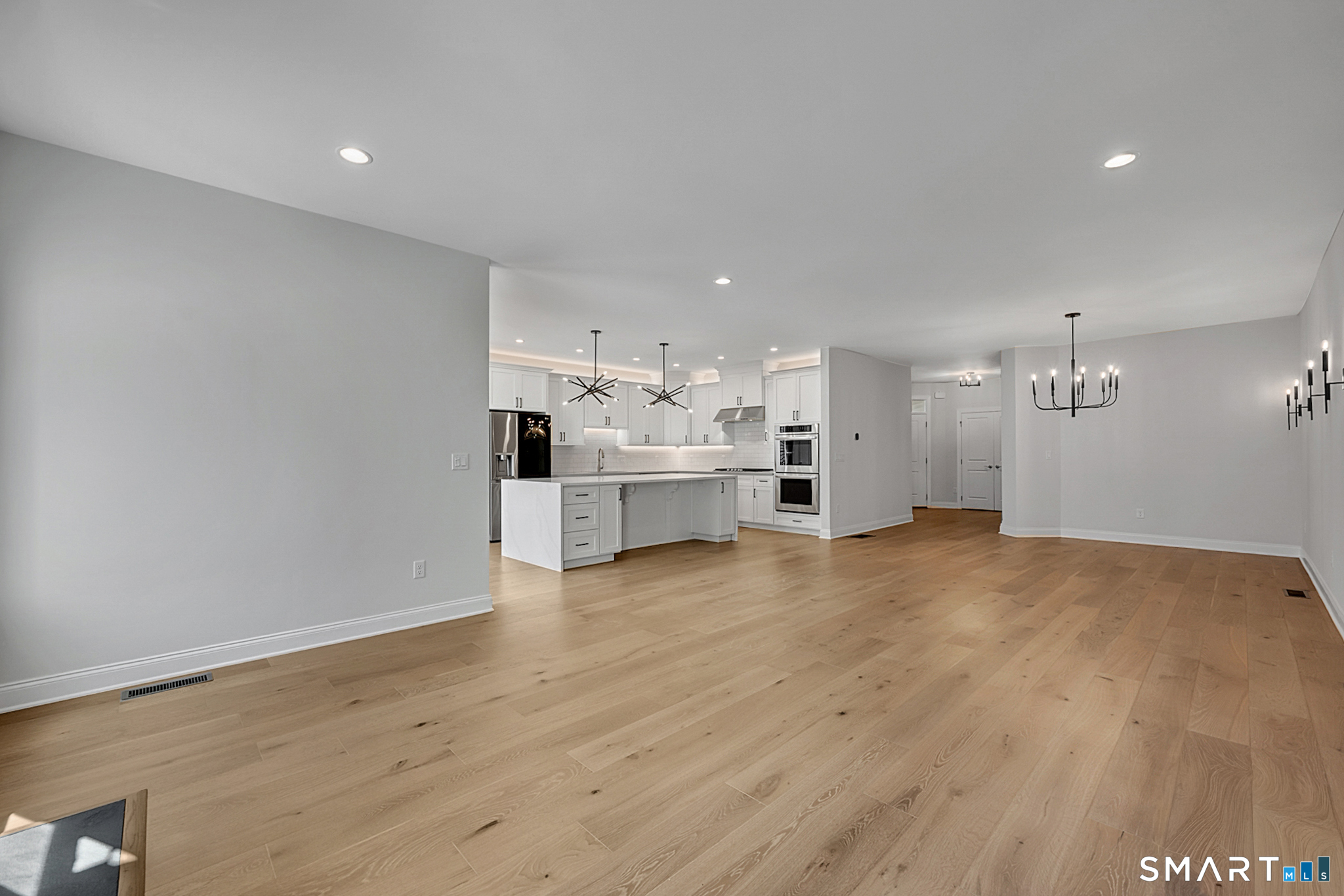193 Ridgewood Drive, Unit 193 Middlebury, CT 06762 - Photo 10 of 40 a view of a kitchen with a sink and a stove top oven