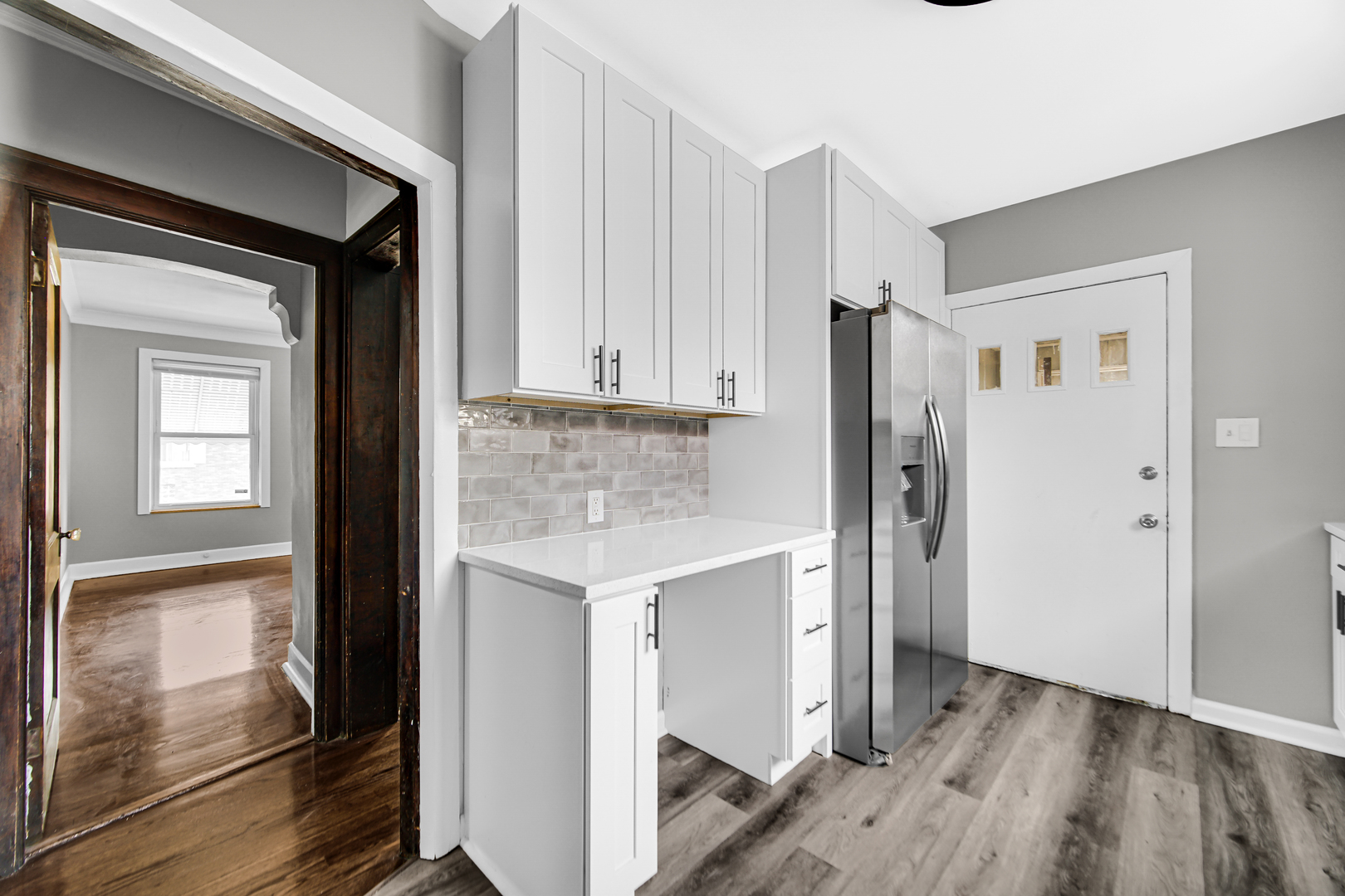 248 Ruth Street Calumet City, IL 60409 - Photo 11 of 19 a kitchen with a refrigerator and cabinets