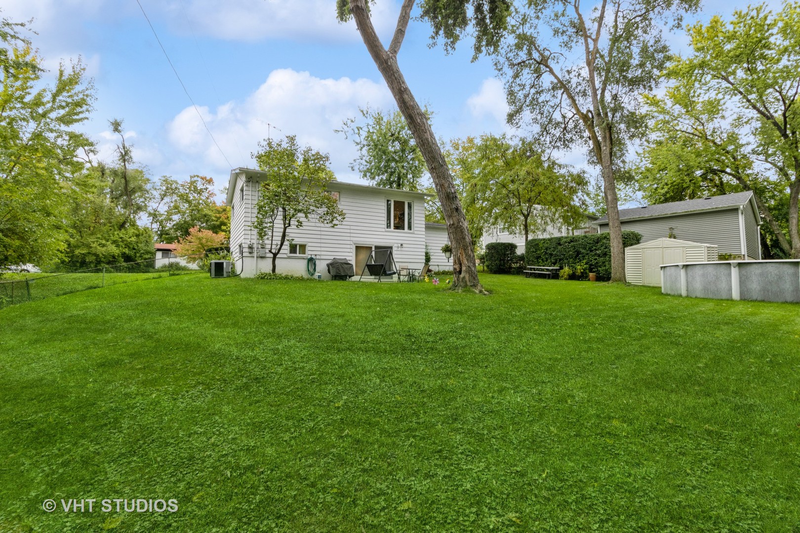 102 Big Oaks Road Streamwood, IL 60107 - Photo 11 of 11 a view of a house with a yard