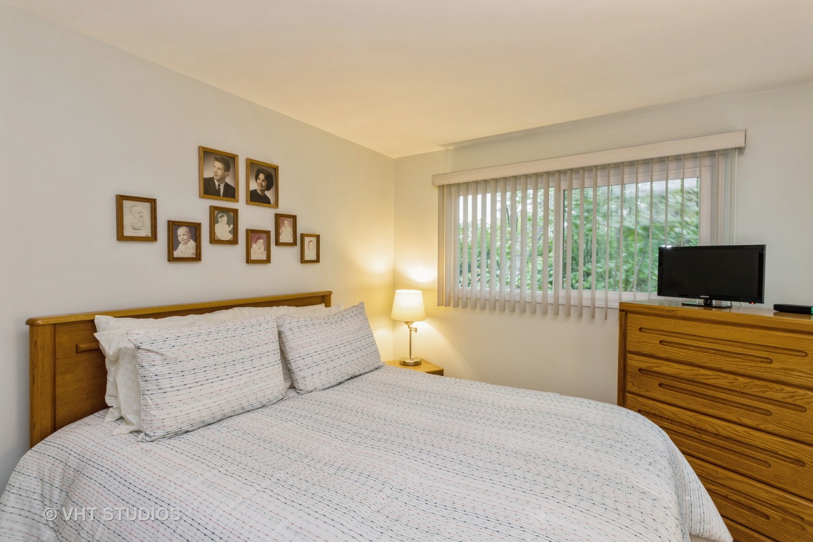 102 Big Oaks Road Streamwood, IL 60107 - Photo 5 of 11 a bedroom with a bed and a television