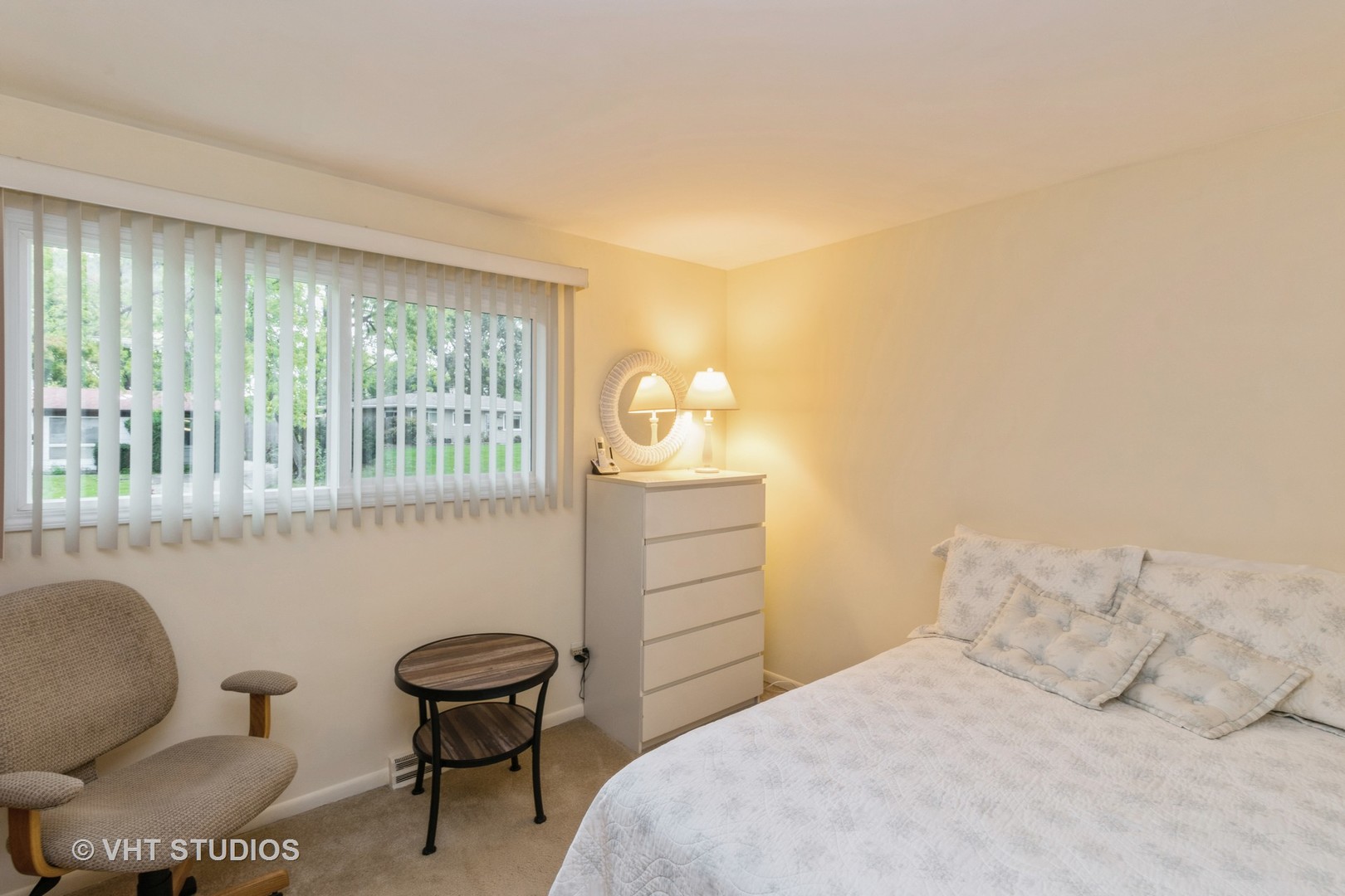 102 Big Oaks Road Streamwood, IL 60107 - Photo 6 of 11 a bedroom with a bed and a chair