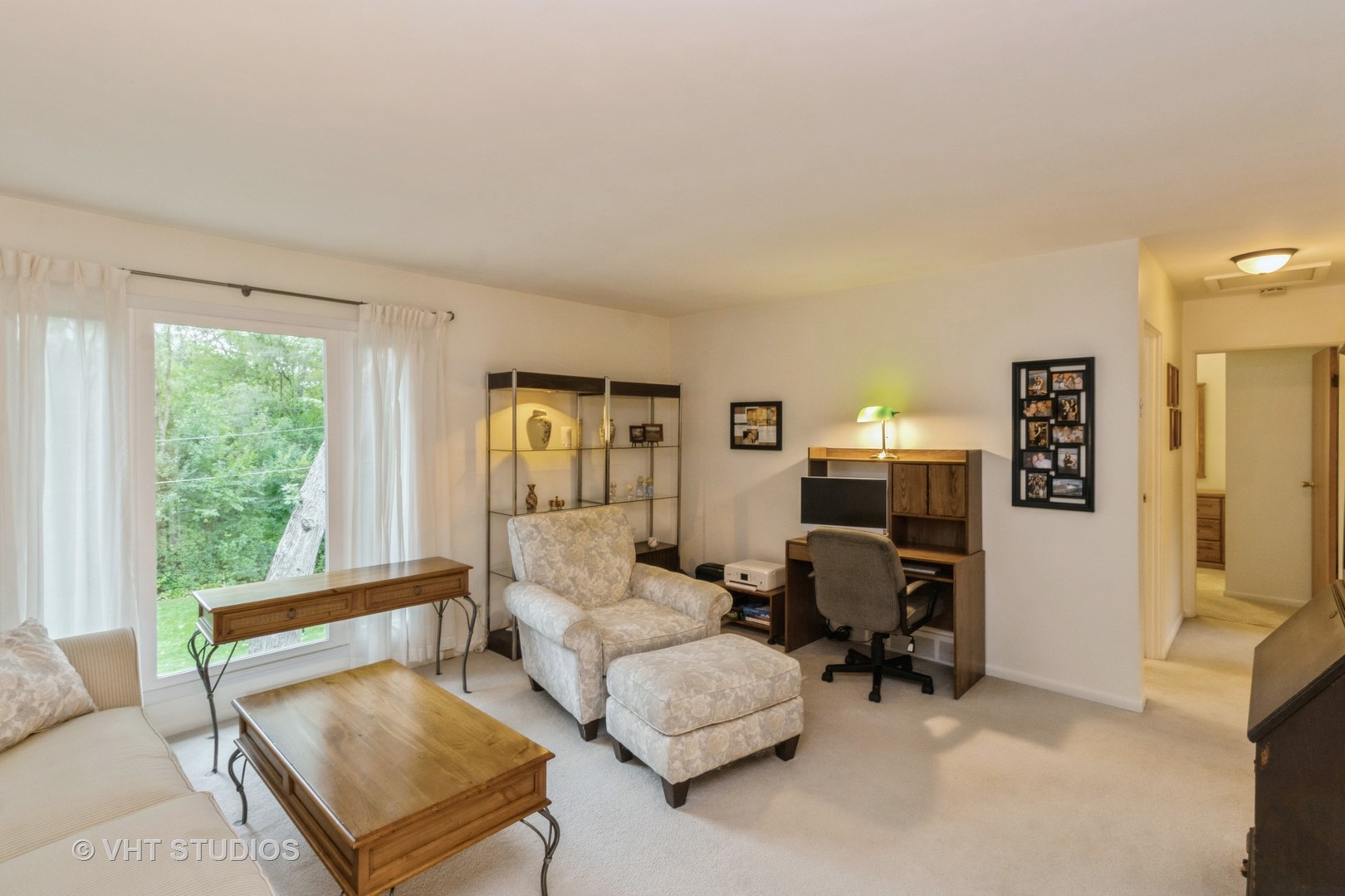 102 Big Oaks Road Streamwood, IL 60107 - Photo 8 of 11 a living room with furniture and a large window