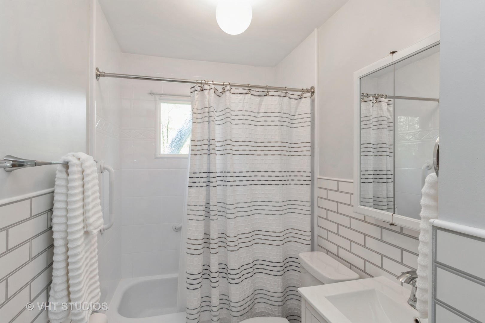 102 Big Oaks Road Streamwood, IL 60107 - Photo 10 of 11 a bathroom with a shower toilet and sink