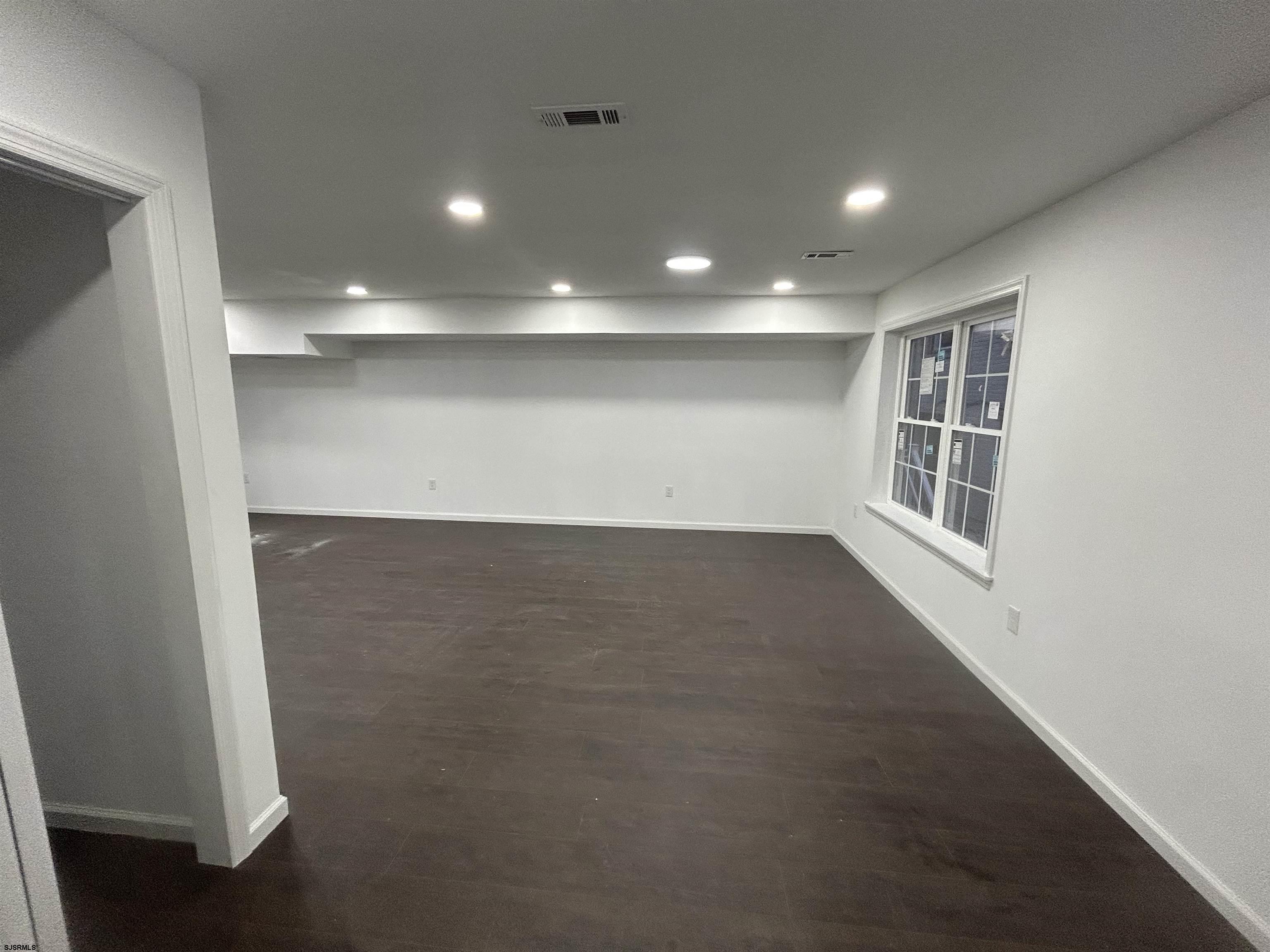 2821 Arctic Avenue, Unit 3 Atlantic City, NJ 08401 - Photo 5 of 11 an empty room with windows