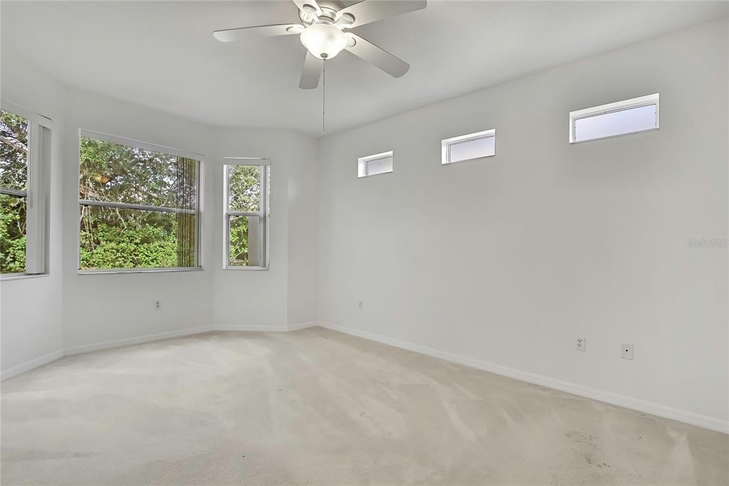 8049 Sanguinelli Road Land O Lakes, FL 34637 - Photo 15 of 45 an empty room with a window