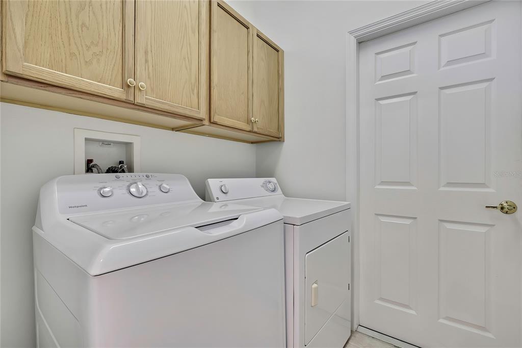 8049 Sanguinelli Road Land O Lakes, FL 34637 - Photo 22 of 45 a utility room with dryer and washer