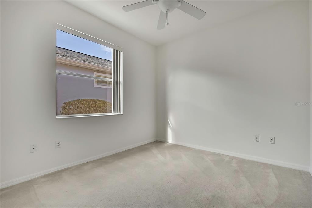 8049 Sanguinelli Road Land O Lakes, FL 34637 - Photo 27 of 45 an empty room with a window
