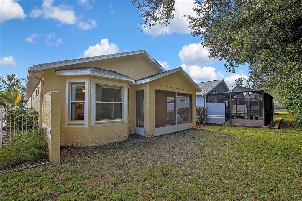 8049 Sanguinelli Road Land O Lakes, FL 34637 - Photo 40 of 45 a view of a house with a yard