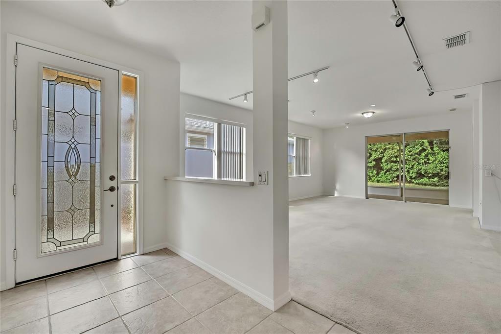 8049 Sanguinelli Road Land O Lakes, FL 34637 - Photo 4 of 45 a view of an empty room with a window