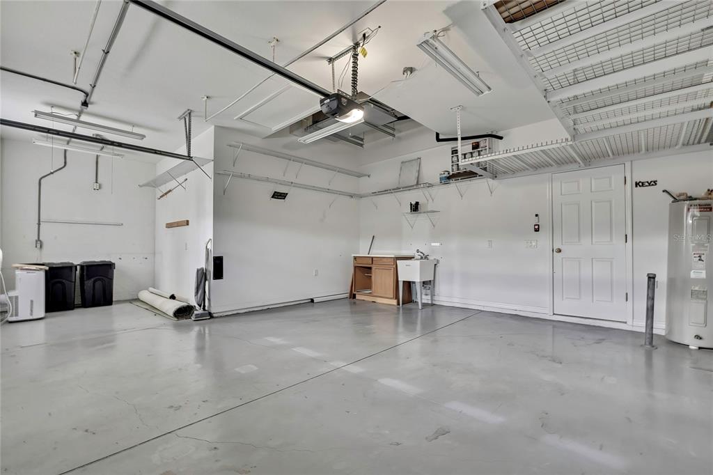 8049 Sanguinelli Road Land O Lakes, FL 34637 - Photo 42 of 45 a view of a livingroom with furniture and a ceiling fan