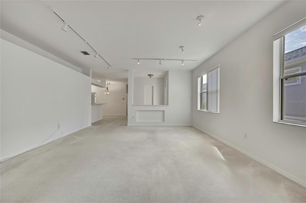 8049 Sanguinelli Road Land O Lakes, FL 34637 - Photo 8 of 45 a view of an empty room with a window