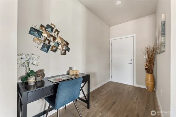 a view of a dining room with furniture and wooden floor