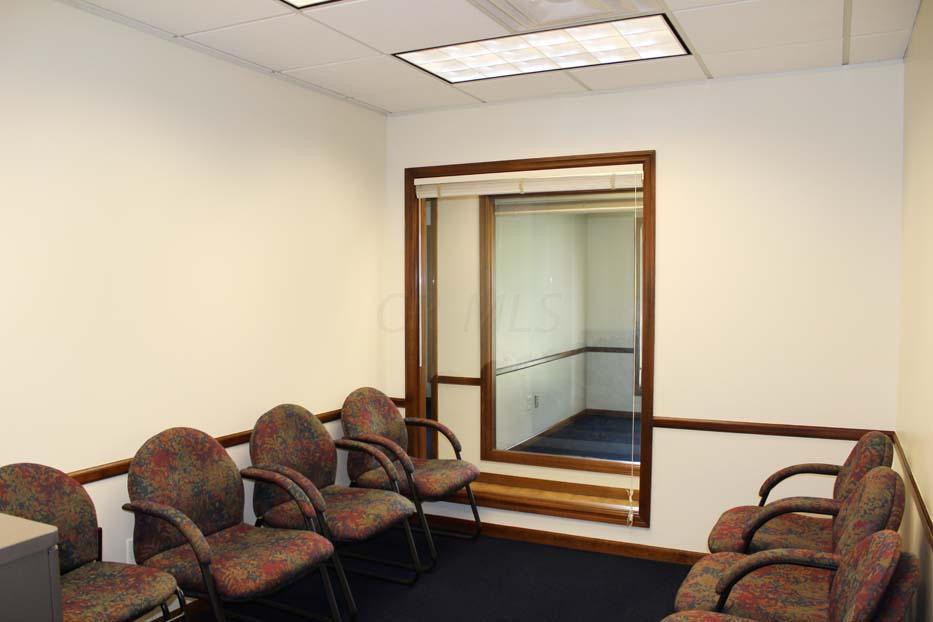 1900 Bethel Road Columbus, OH 43235 - Photo 15 of 24 New blue carpet ~02. Ivory painted walls. Suspended ceiling. Fluorescent lighting. Crown molding.